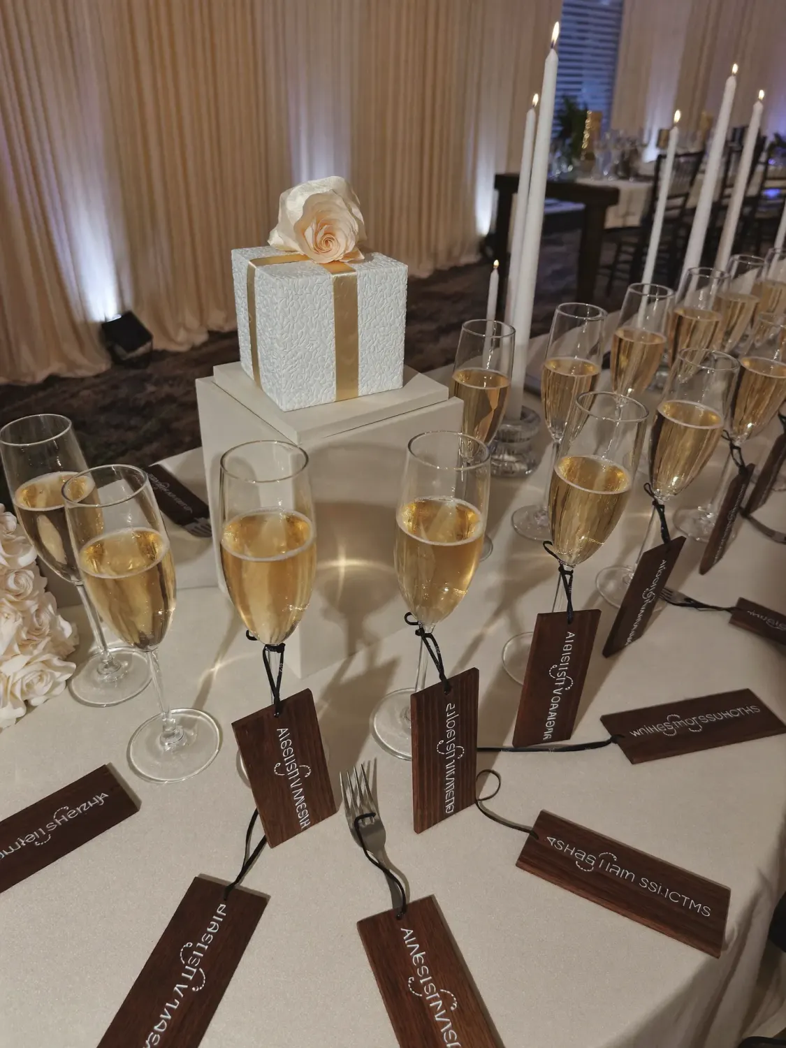 Bridal shower setup with personalised engraved wooden favours and champagne glasses