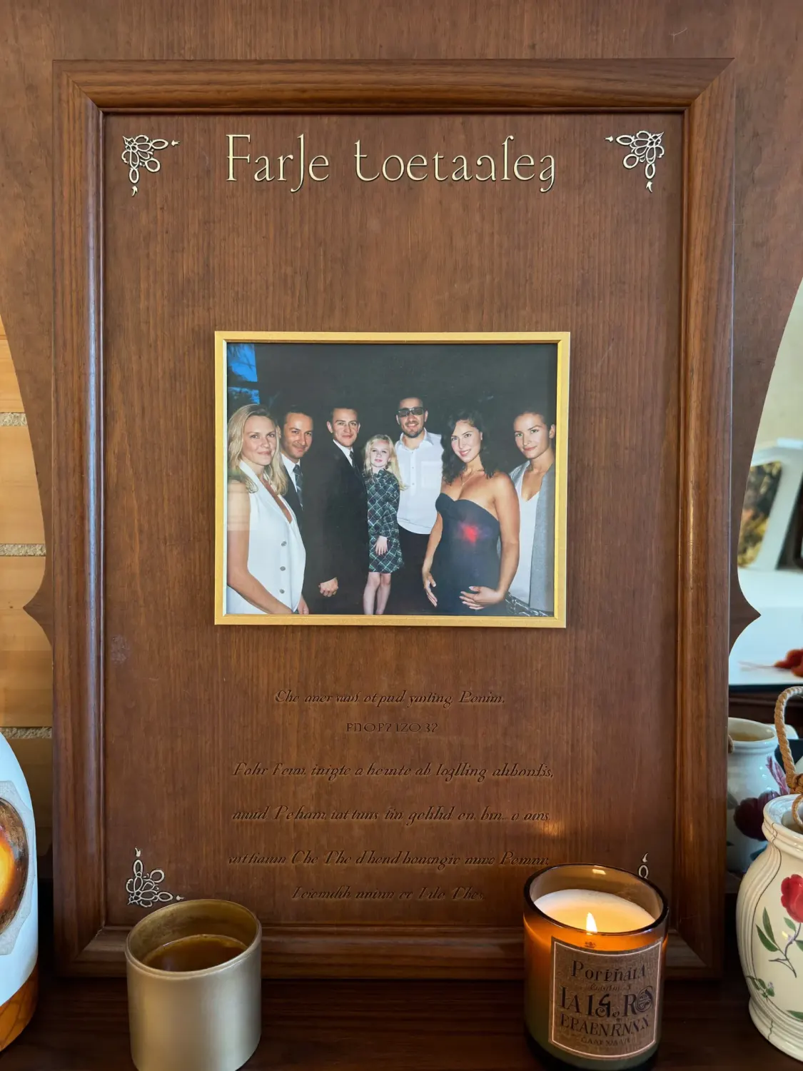 Framed laser engraved wooden portrait plaque preserving a family photograph